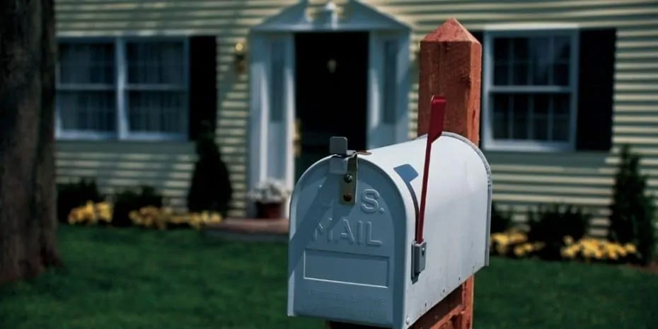traditional mailbox in front of suburban home